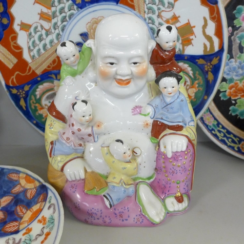 827 - Two Chinese chargers, an Imari plate, ginger jar and two large oriental figures, one a/f