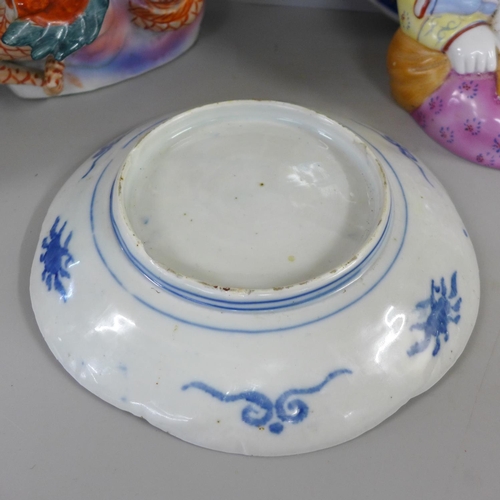 827 - Two Chinese chargers, an Imari plate, ginger jar and two large oriental figures, one a/f