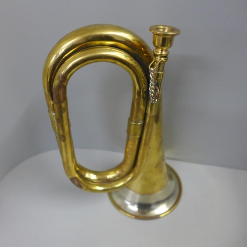 834 - A bugle with later applied German badge