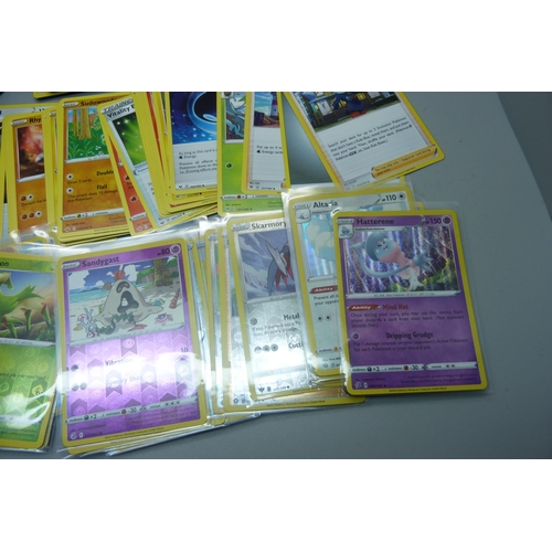 839 - 30 Holo/reverse holo and 300 common/uncommon/rare Pokemon cards in tin