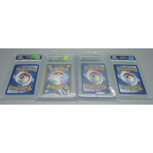 856 - Four graded Pokemon cards including Dark Charizard, French 1st Edition Voltali, etc.