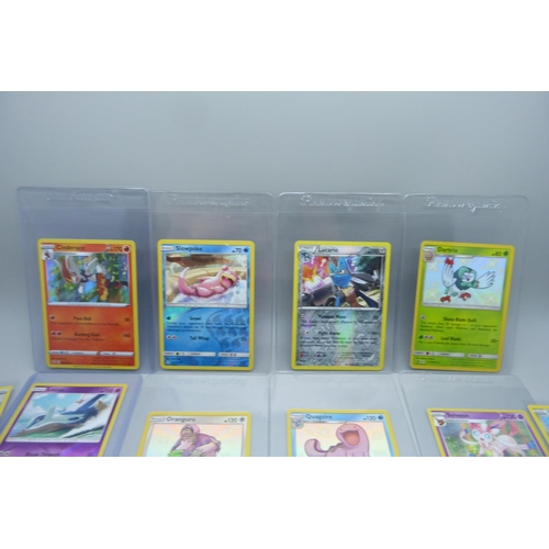 857 - Fifty-three holographic Pokemon cards