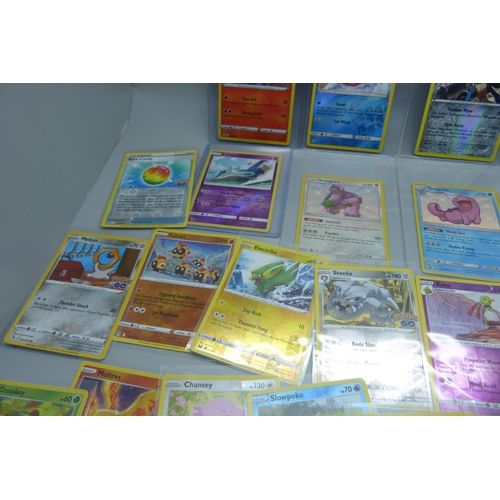 857 - Fifty-three holographic Pokemon cards