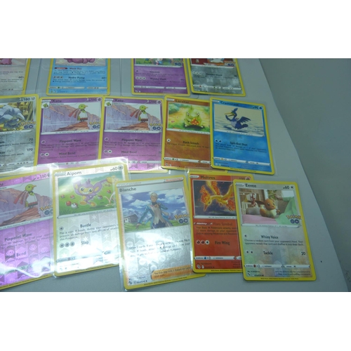 857 - Fifty-three holographic Pokemon cards