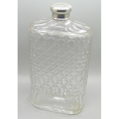 867 - A silver topped glass flask