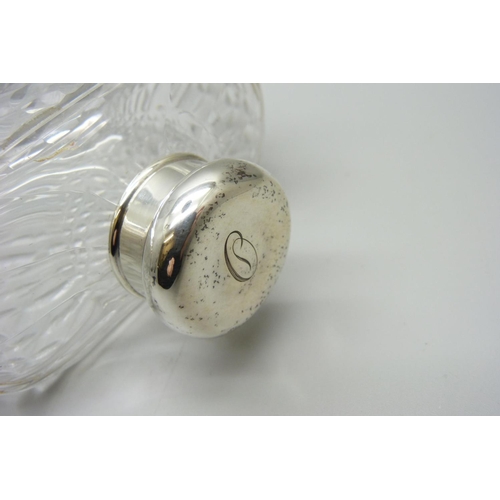 867 - A silver topped glass flask