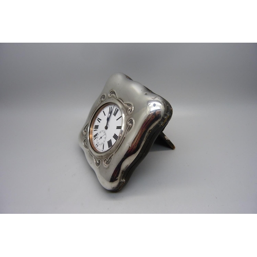 884 - A Goliath 8-Days pocket watch in a silver fronted watch stand