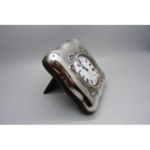 884 - A Goliath 8-Days pocket watch in a silver fronted watch stand