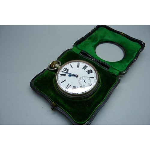 884 - A Goliath 8-Days pocket watch in a silver fronted watch stand