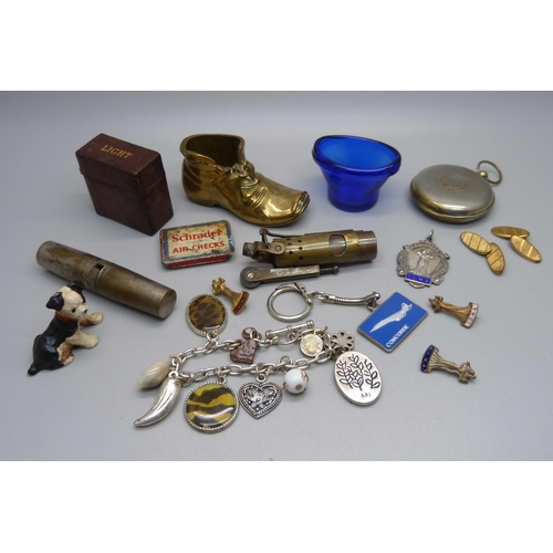 921 - Assorted items including a lighter, a vesta case in the form of a pocket watch case, a silver dancin... 