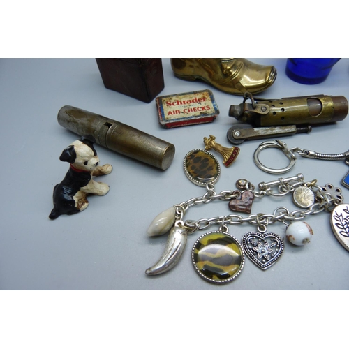 921 - Assorted items including a lighter, a vesta case in the form of a pocket watch case, a silver dancin... 