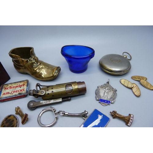 921 - Assorted items including a lighter, a vesta case in the form of a pocket watch case, a silver dancin... 