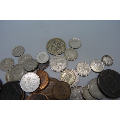 923 - Coins; an 1815 Sheffield penny token, three 50p comprising 2x D-Day and one NHS, two crowns, etc.