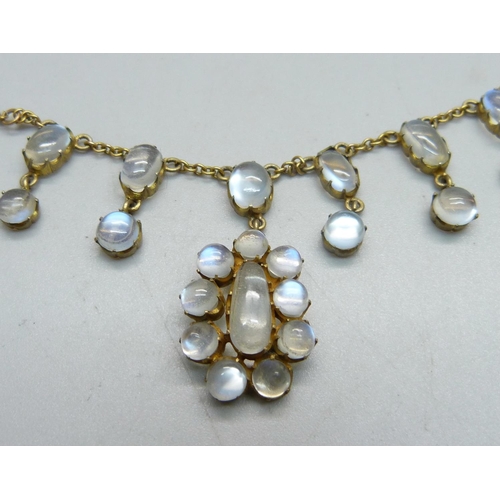 955 - A gilt metal cluster pendant fringe necklace set with cabochon moonstones