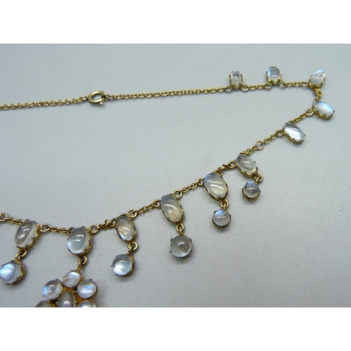 955 - A gilt metal cluster pendant fringe necklace set with cabochon moonstones