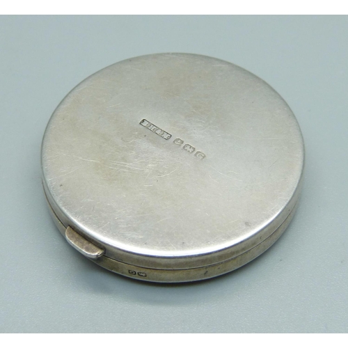 980 - A hallmarked silver compact, 48mm