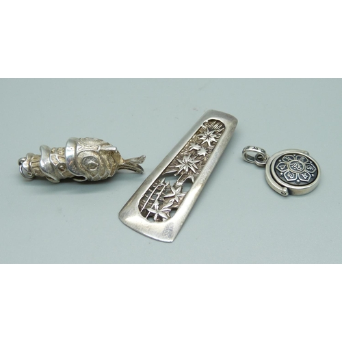 981 - A hallmarked silver fish pendant, a swivel fob pendant and one other pendant