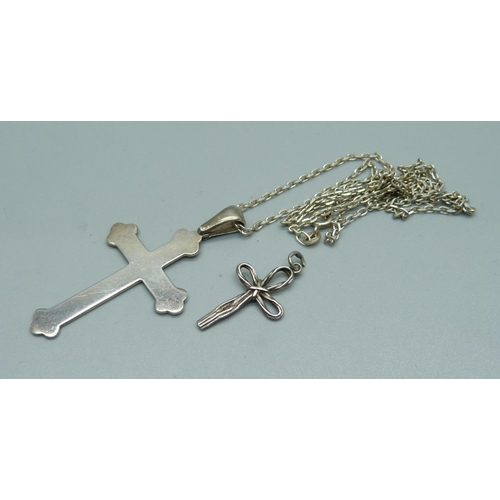 983 - A silver cross pendant and chain and one other cross pendant