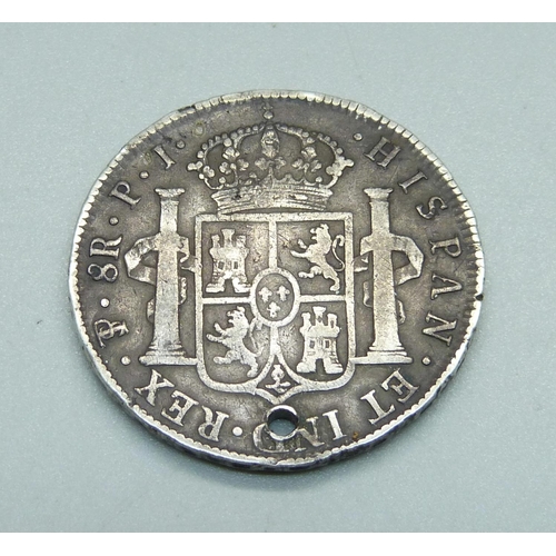 984 - An 8 Reals piece of eight coin, 1823, a/f, drilled