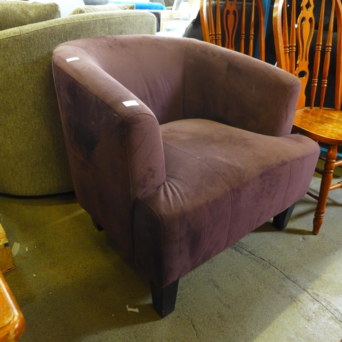 1537 - A plum upholstered armchair