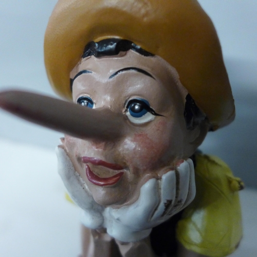 1307 - A sitting Pinocchio figure (RM5410)