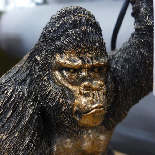 1339 - A gorilla holding a bulb table lamp, H 30cms (3148923)   #