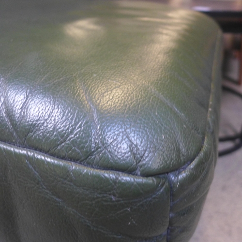 1565 - A green leather and oak footstool