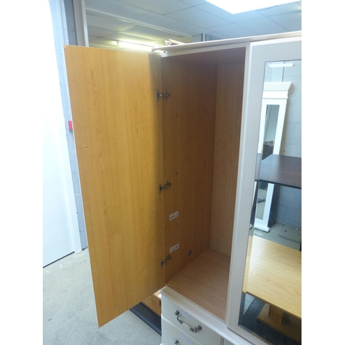 1610 - A white painted three door, six drawer wardrobe