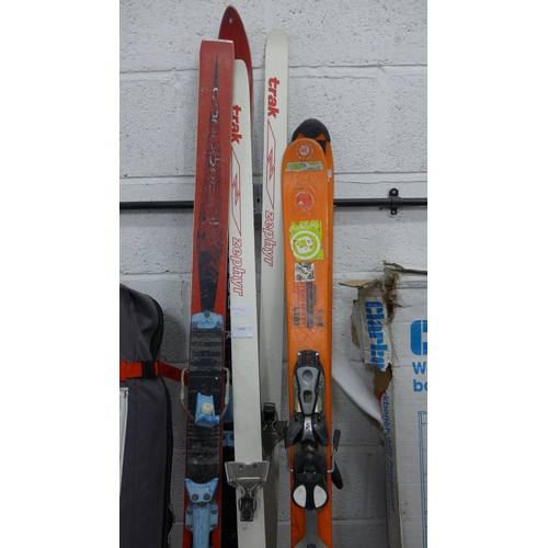 2365 - Three sets of skis (Zephyr, Salomon, Rossignol) and two pairs of ski boots