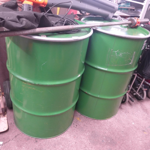 2405 - 2 green 200 ltr metal barrels