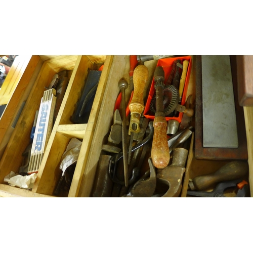 2411 - Wooden tool chest containing two trays of tools including hand drills, saws, screwdrivers and chisel... 