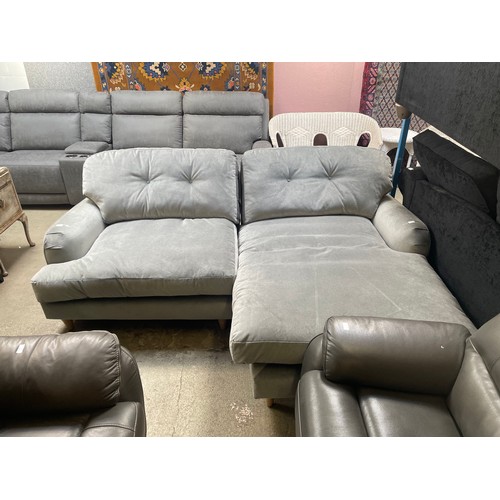 1541 - A grey velvet L shaped sofa on turned legs