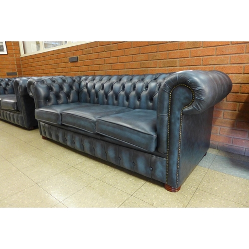 2 - A blue leather Chesterfield settee