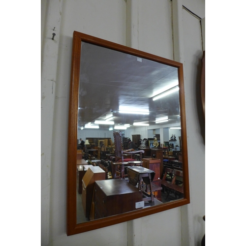 25 - A teak framed mirror