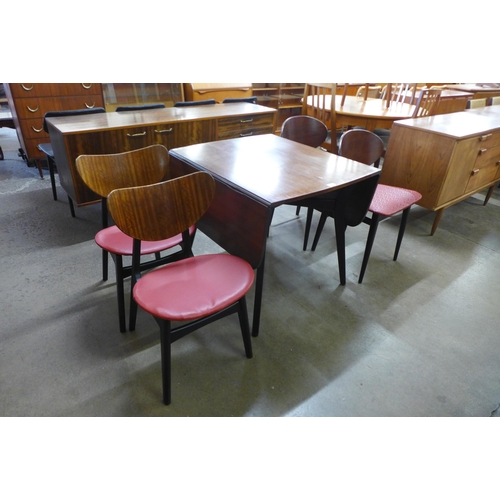 27 - A G-Plan Librenza tola wood drop-leaf table and two pairs of chairs