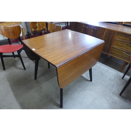 27 - A G-Plan Librenza tola wood drop-leaf table and two pairs of chairs