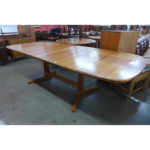 38 - A Danish teak extending dining table