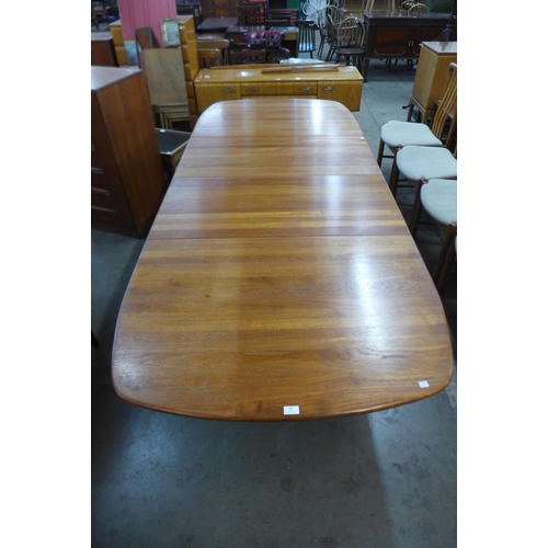 38 - A Danish teak extending dining table