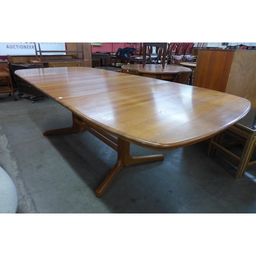 38 - A Danish teak extending dining table