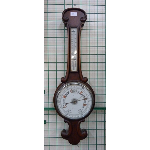 380 - A Victorian walnut aneroid barometer, the dial signed Nottingham