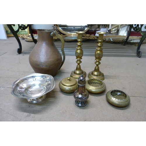 383 - Copper and brassware including a large jug and a pair of candlesticks