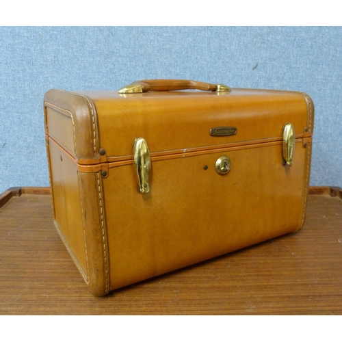 392 - A small brown leather Samsonite trunk