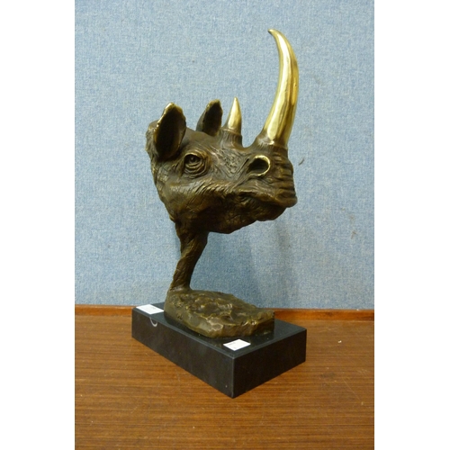 396 - A bronze figure of a rhino head, after Salvador Dali