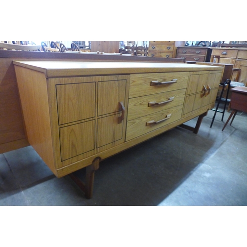 55 - A teak sideboard