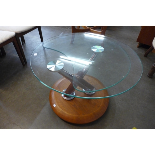 60 - A Danish teak and glass two tier swivel coffee table