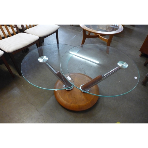 60 - A Danish teak and glass two tier swivel coffee table