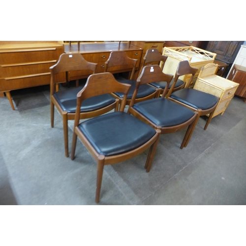 61 - A set of six Danish style teak and black vinyl dining chairs