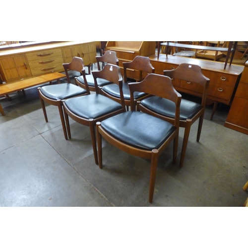 61 - A set of six Danish style teak and black vinyl dining chairs