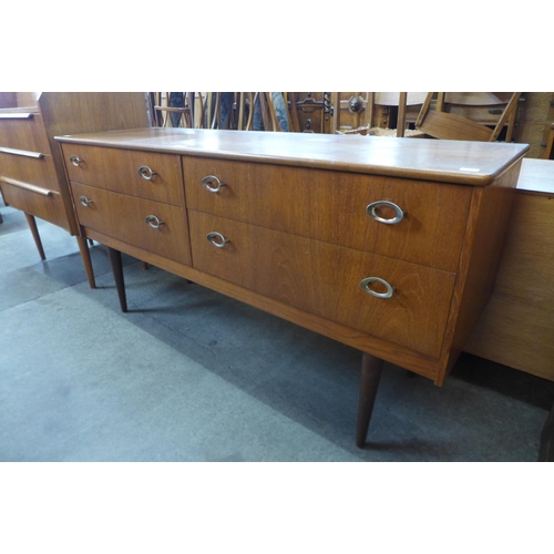 64 - A small teak four drawer sideboard