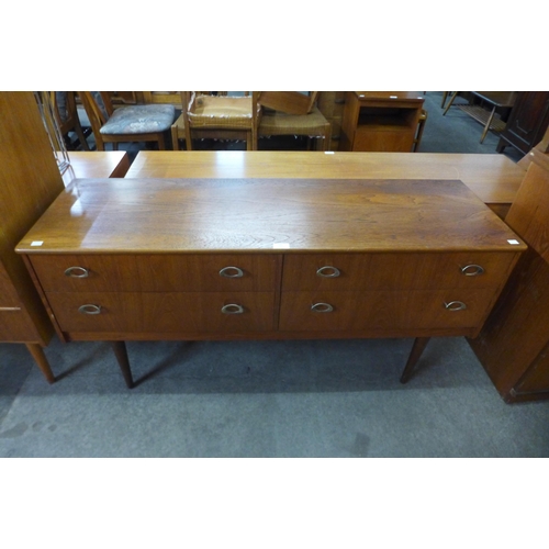 64 - A small teak four drawer sideboard